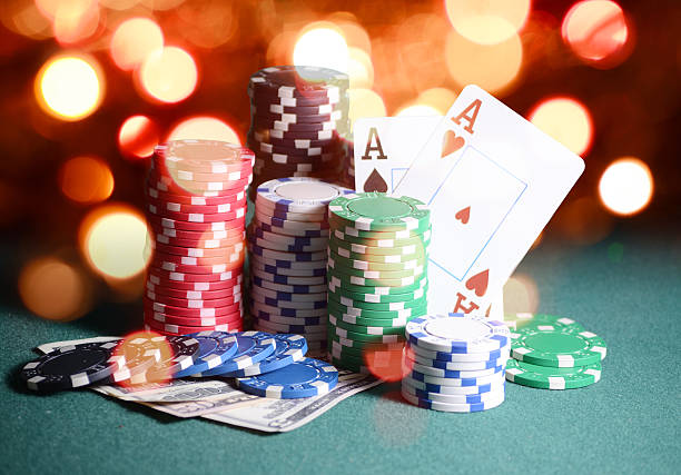 istock Casino chips and cards, two aces on the playing green 610140770