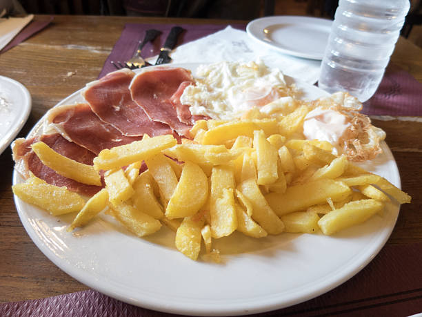 istock french fries iberian ham and eggs 610141688