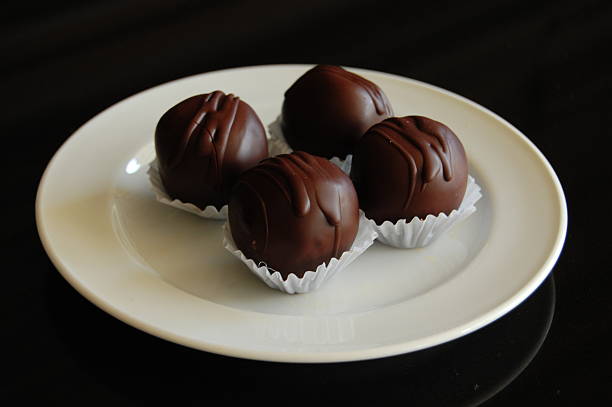 istock Assorted dark chocolate truffles with cocoa powder, 610142242