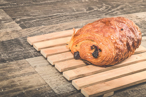 istock Delicious chocolate croissant on a bamboo plate 610144934