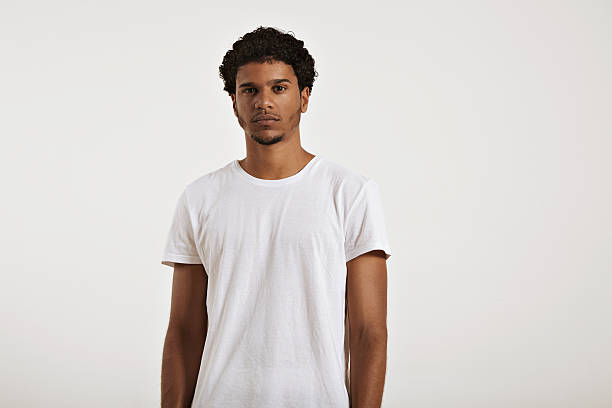 Attractive male model presenting blank white t-shirt stock photo