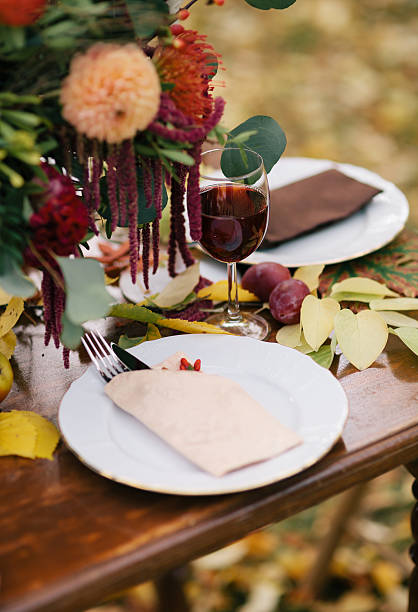 istock Glass of red wine on a table. 610147176