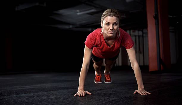 Shot of a young woman working out inside the gym