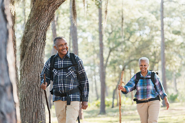 istock African American seniors hiking through woods 610151722