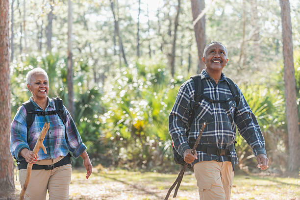 istock African American seniors hiking through woods 610151842