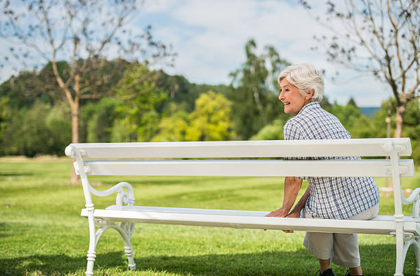 istock Senior Women Sitting On Park Bench 610154096