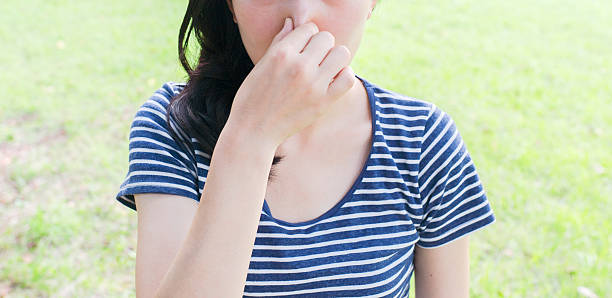 Woman feeling bad smell Woman feeling bad smell. bad breath couple stock pictures, royalty-free photos & images