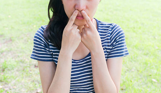 istock Woman feeling bad smell 610155934