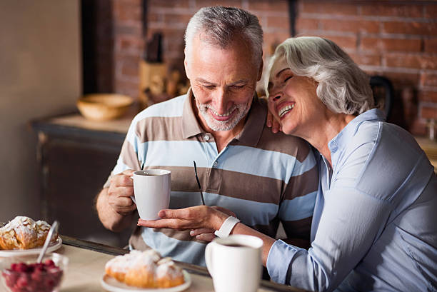 istock Happy old couple having coffee together 610159548