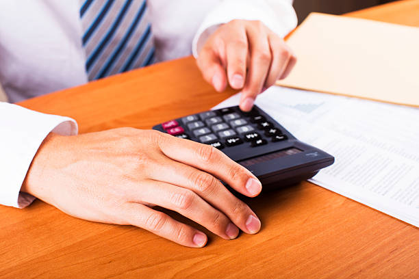 istock Man doing his accounting, financial adviser working 610218156