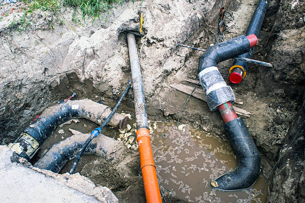 istock Several Pipes in the Earthen Trench  for Heating System 610219222