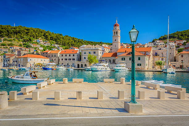 Pucisca island Brac Croatia. View at small mediterranean place on Island Brac, Pucisca town, Croatia. old catholic church on island brac croatia stock pictures, royalty-free photos & images