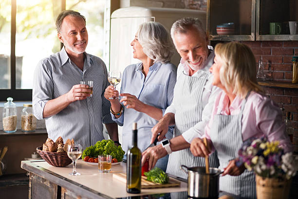 istock Two aged families getting together for lunch 610219364