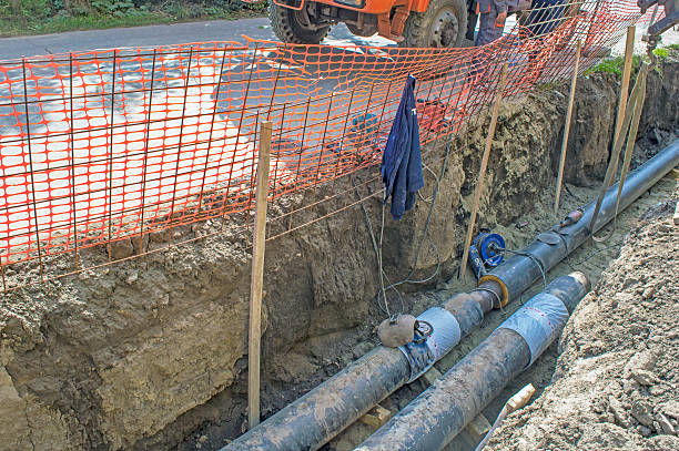 istock Pipes in the Earthen Trench  for Making the Pipeline 610219448