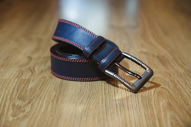 istock Wedding men's belt lying on the floor 610219490