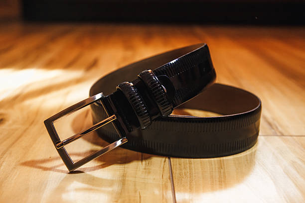 istock Wedding men's belt lying on the floor 610220134