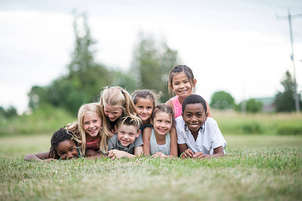 istock Children Stacked in a Dog Pile 610221670