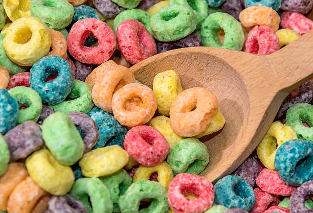 istock wooden spoon with round colorful cereal 610221774