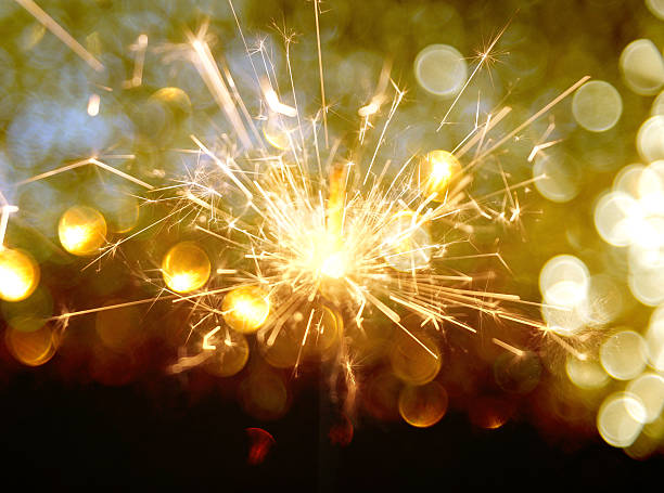 istock sparkler on gold bokeh background macro close up 610222446