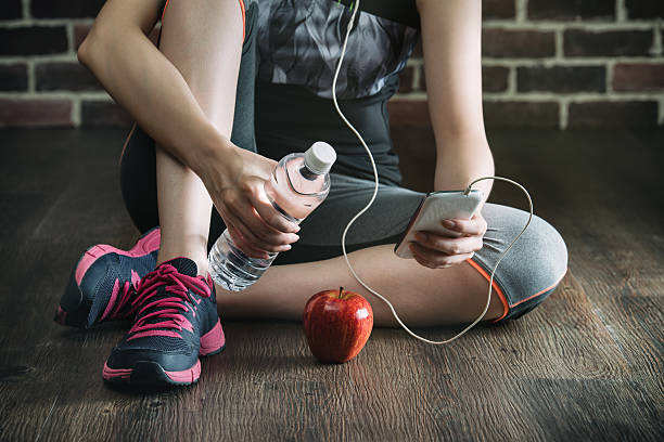 istock take rest listening to music drinking water eating apple 610222926