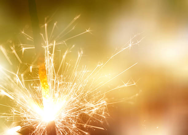 istock sparkler on gold bokeh background macro close up 610223634