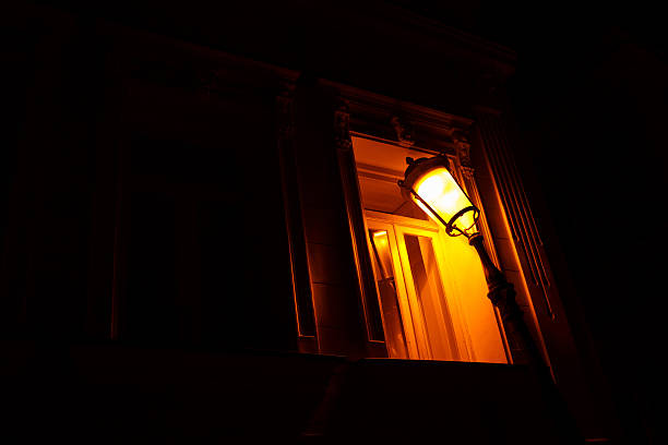istock old city lamp shine at nigt at window 610223652