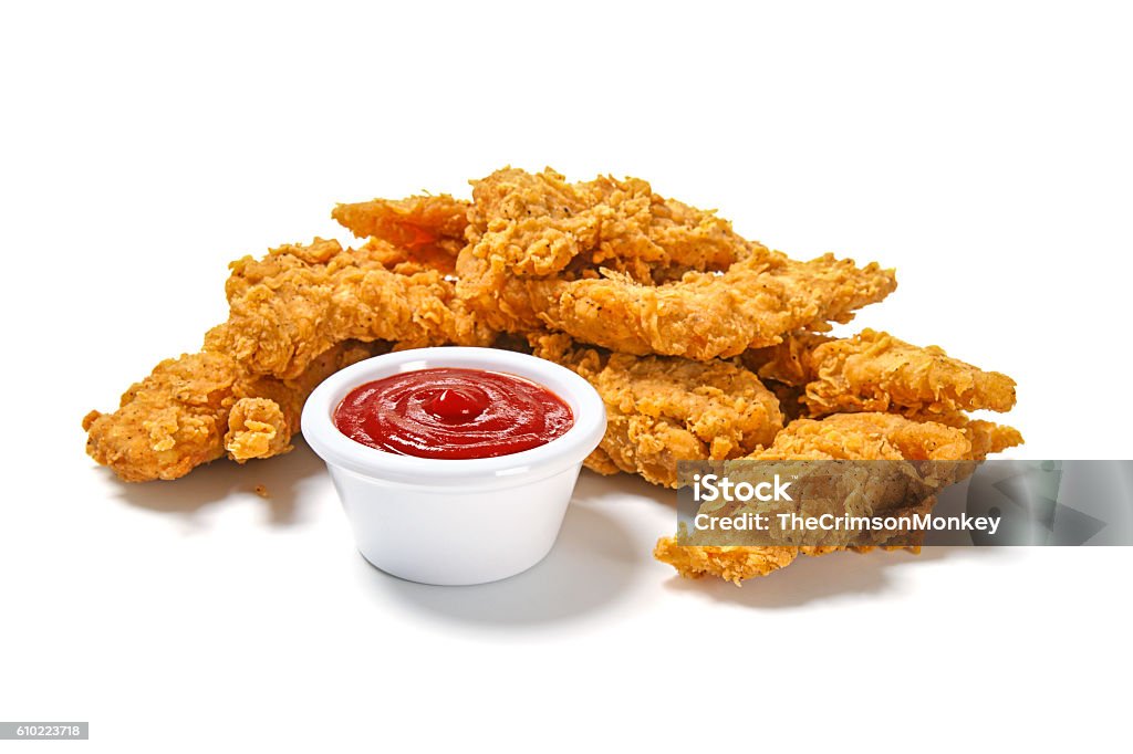 Fried Chicken Strips High resolution digital capture of a serving of crispy, golden, fried chicken strips, with ketchup, on a pure white background. Chicken Meat Stock Photo