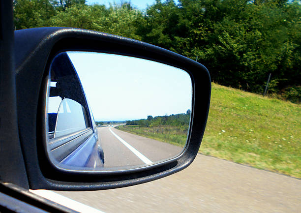 istock Horizon over highway in a rearview mirror 610223918