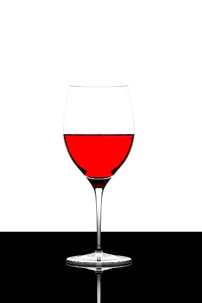 istock red wine glass on a  black board isolated and backlit 610224236