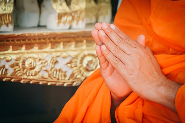 istock Closeup Hand Pray of Thai Monk. 610229360