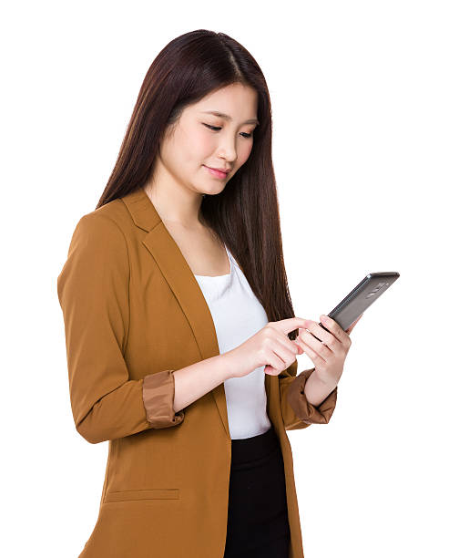 istock Businesswoman using smartphone 610229742