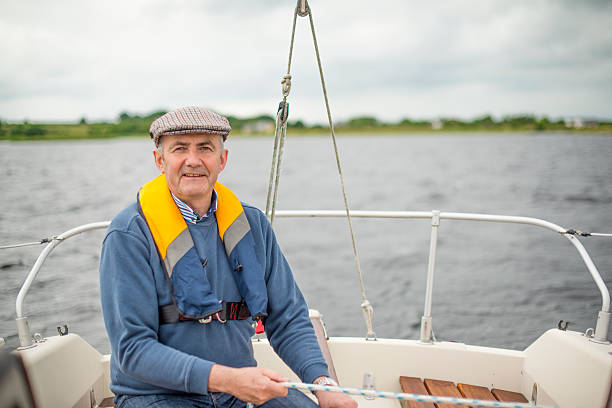 istock Handsome senior man sailing in the open waters 610231372