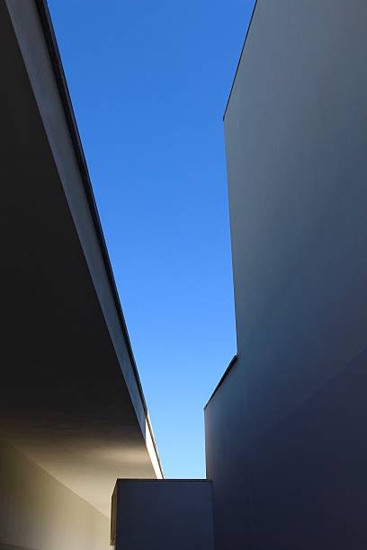 istock Abstract buildings against blue sky 610231534