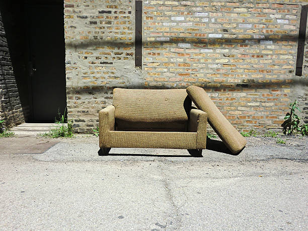 istock Couch abandoned in urban alley 610232002
