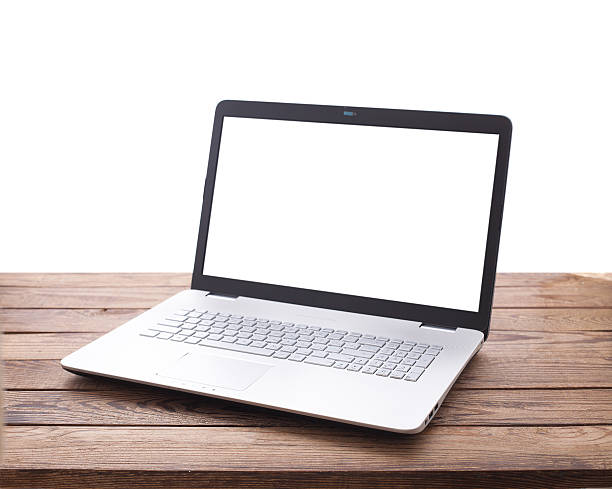 istock Modern laptop on wooden table isolated 610232150