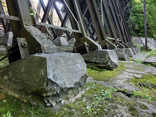 istock Concrete footings on steel bridge girder supports 610233316