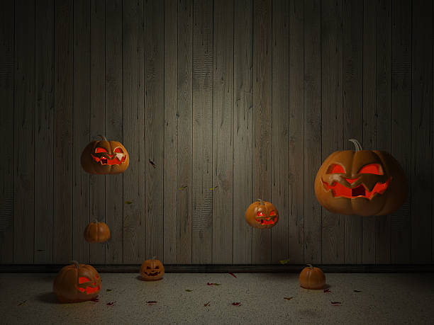 istock halloween pumpkins in old dark room with leafs -interior background 610233398