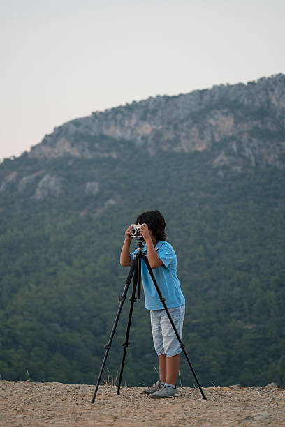 istock Little boy photographer 610234466