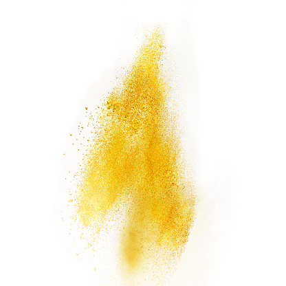 Sprinkled yellow condiment, studio shot, selective focus. 