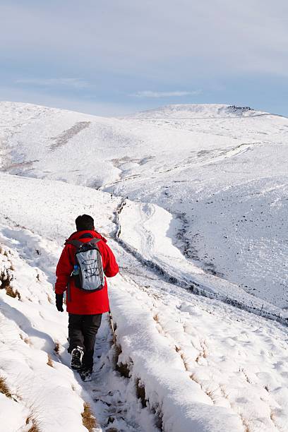 istock Asian woman hiking in snow 610236106