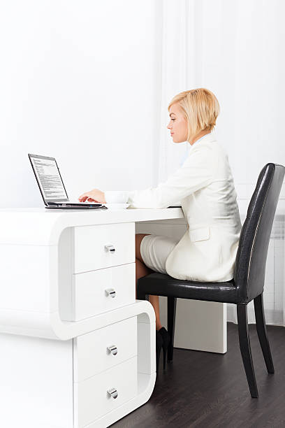 istock business woman using laptop typing 610238844