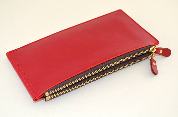 istock Red women's purse on a white background 610239320