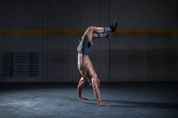 handstand balance exercise from an upright position with the hands, steps are taken to advance chico california photos stock pictures, royalty-free photos & images