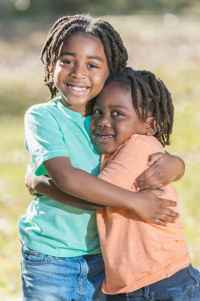 istock Two little African American boys hugging 610240254