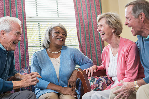istock Group of four multi-ethnic seniors sitting and talking 610240544