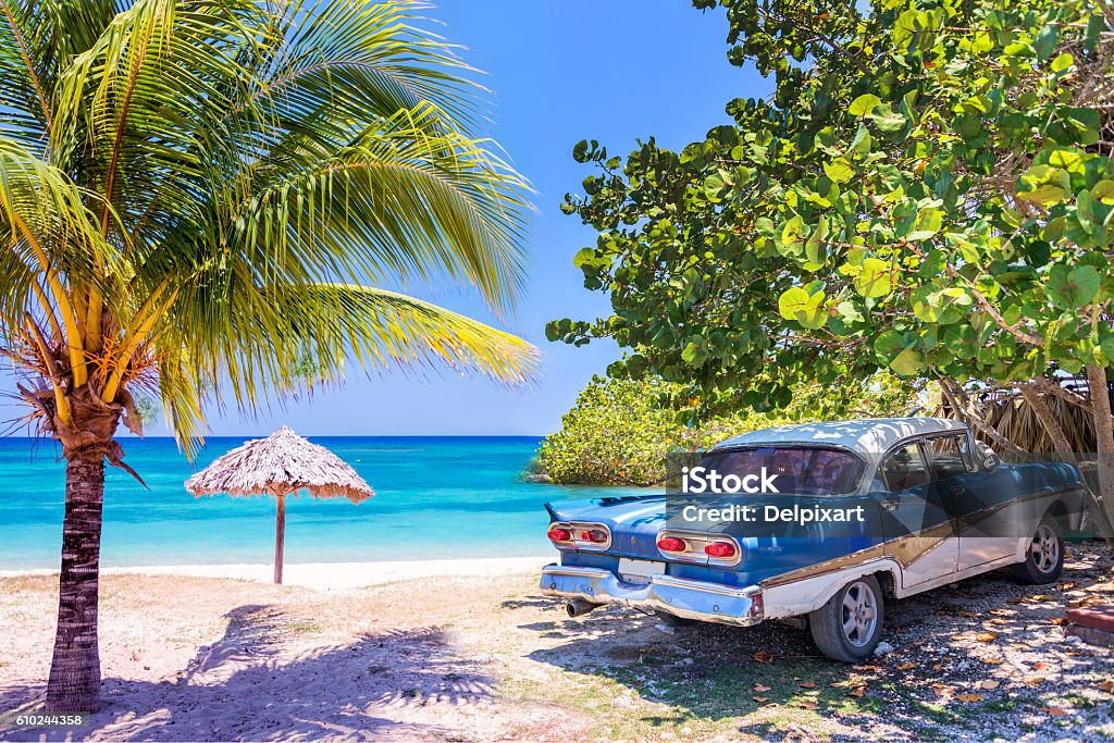 Vintage american oldtimer car parked on a beach in Cuba Cuba Stock Photo