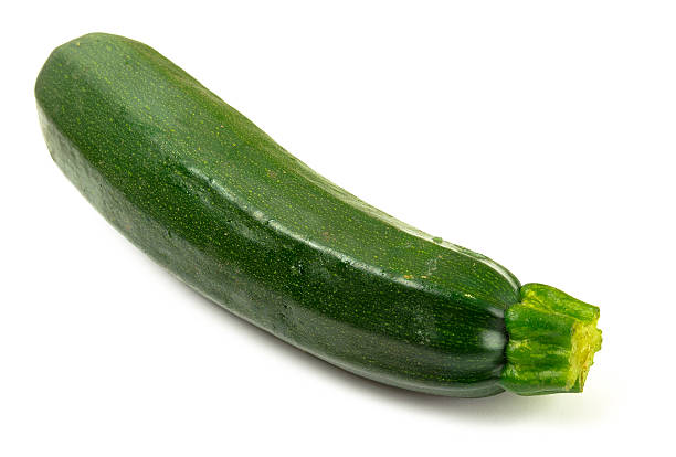 istock Delicious fresh green zucchini on white background 610246272