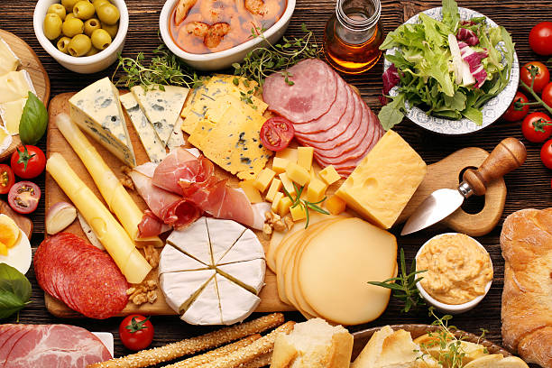 istock Board of various types of cheese and appetizers set 610246328