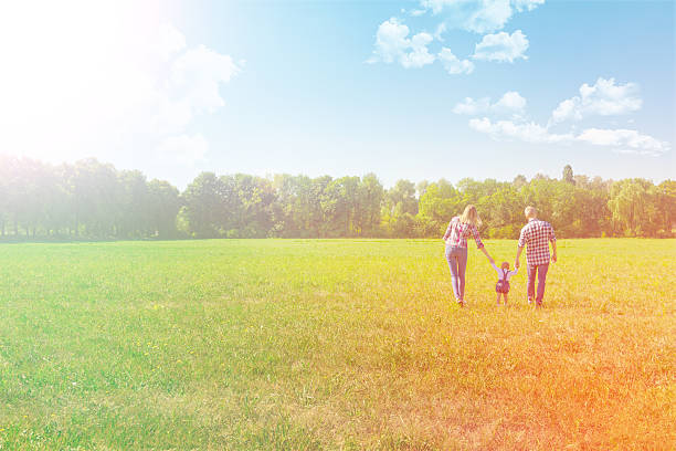 istock Happy family walking together 610246472