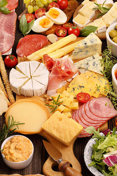 istock Board of various types of cheese and appetizers set 610246526